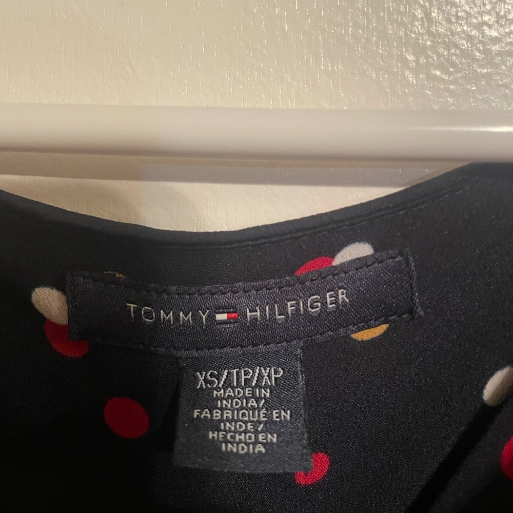 Black Tommy Hilfiger dress with red,white, and gold polka dots.